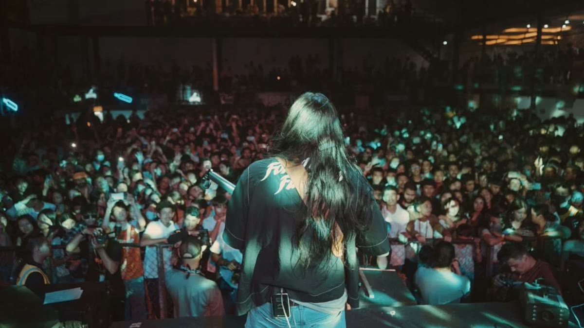 A packed crowd seen from the stage at a Kuma Sagar concert